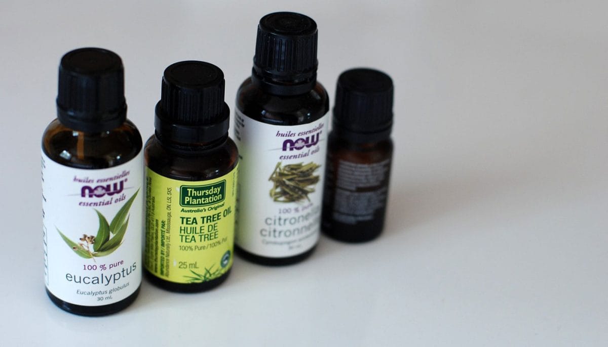 four essential oil bottles